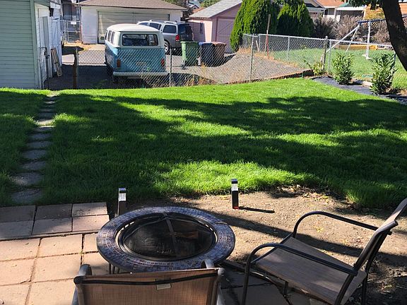 Firepit and backyard with off-street parking.
