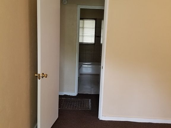 Door to Hall and Bathroom