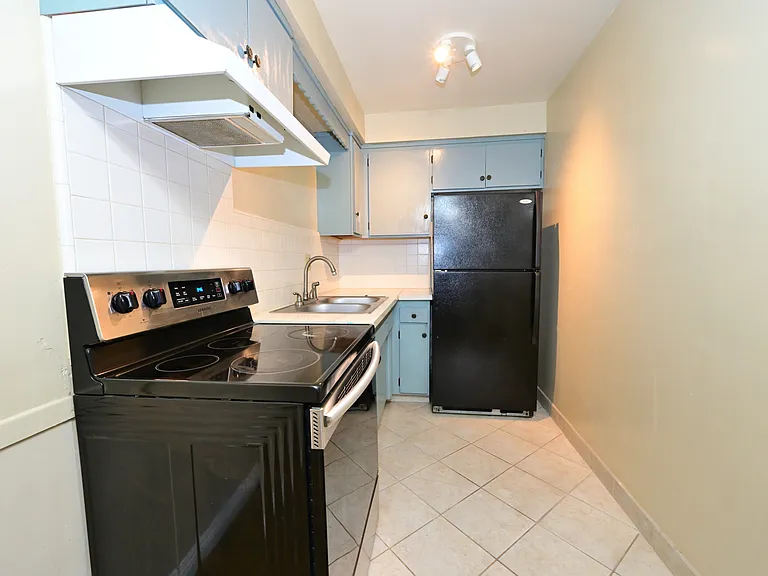 Updated kitchen with quartz countertop, SS appliances.