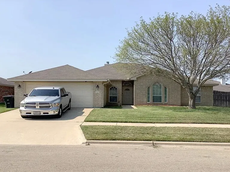 Handsome curb appeal & cared beautifully for lawn.