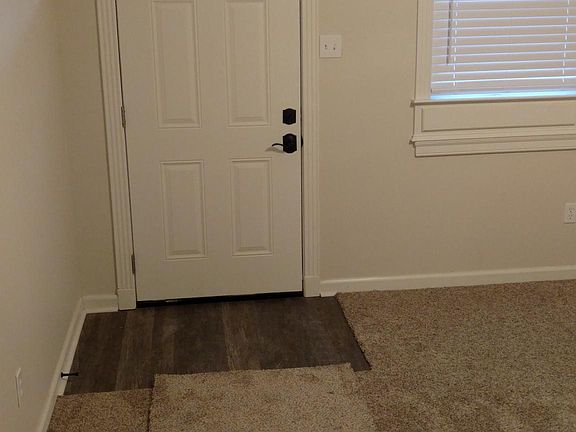 Crown molding with Schlage exterior door knobs.