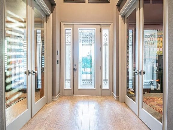 Double Front Designer doors, and double glass French Doors on the his and her dens.