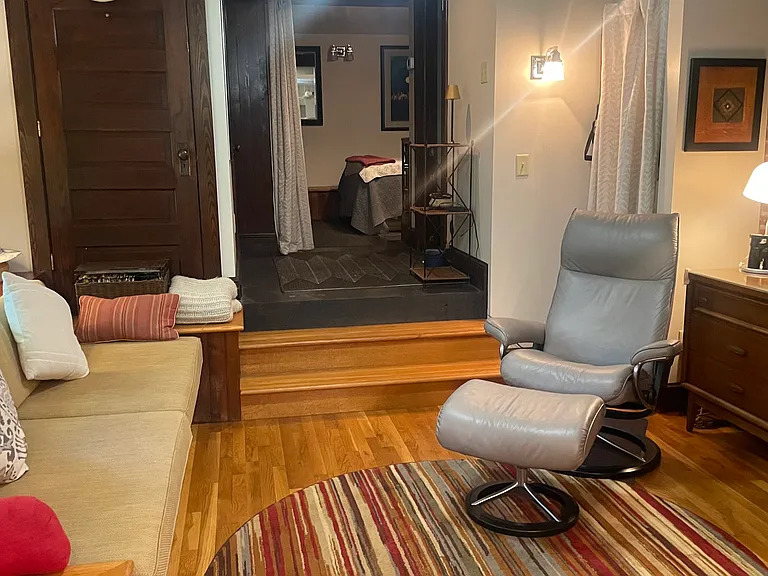 Put your feet up and relax in the living area. Television with streaming provided and daybed outfitted for one over night guest.