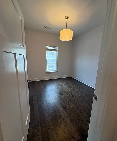 This second floor bedroom is located just off the kitchen. There is a full bath just across the hall