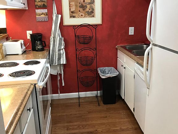 Kitchen with new appliances and hard wood flooring