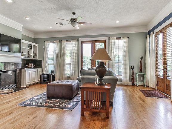 French doors on either side lead to the beautifully landscaped backyard.