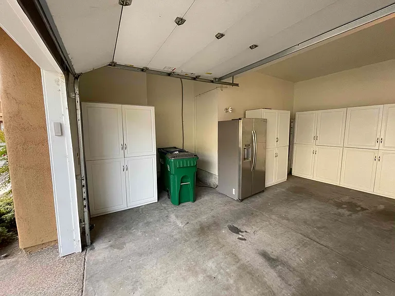 Ample storage in the garage and area to store recycling and garbage container.