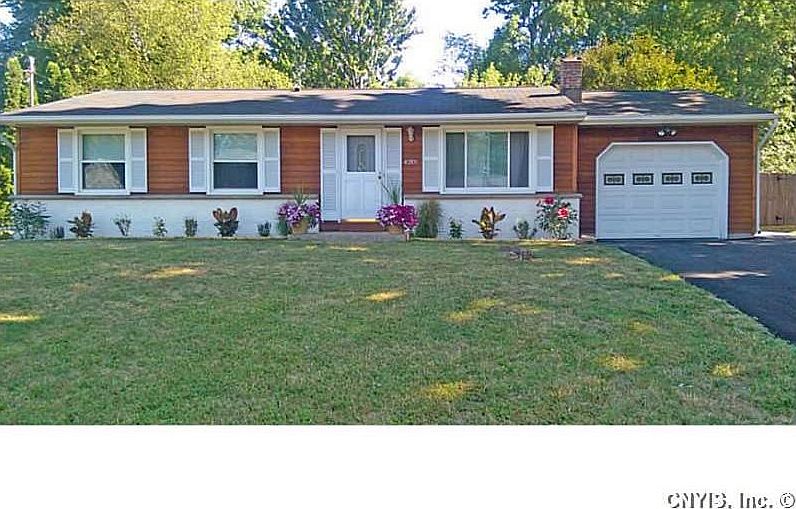 Exterior Front. New Landscaping & 4 car driveway.