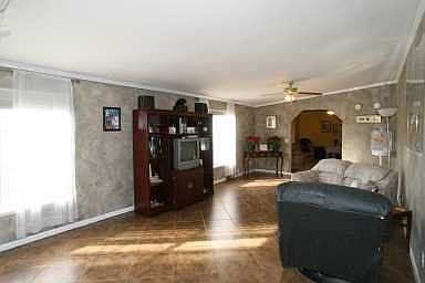 Family Room, 15 x 13, with fireplace, window treatments