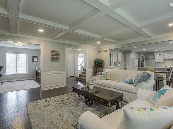 Box beam ceilings & hand scraped hardwood floors are perfection