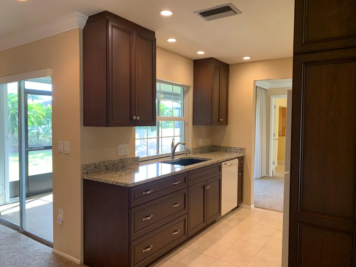 Kitchen looking out lanai and backyard - 3957 Lemonwood Dr