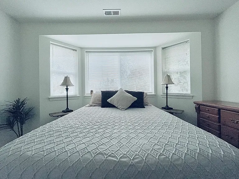 Large bedroom with bay window.