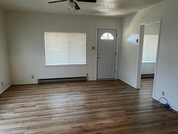Living room area, door to first bedroom.