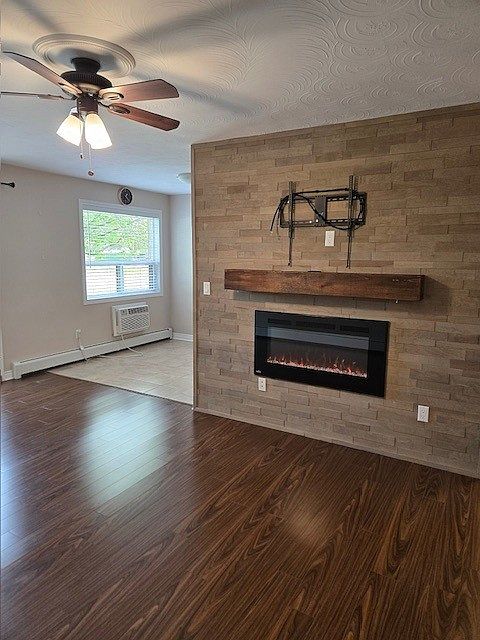 Living room area with feature fireplace wall