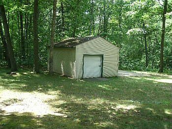 STORAGE SHED IN BACK YARD IN ADDITION TO THE 2 12 CAR GARAGE