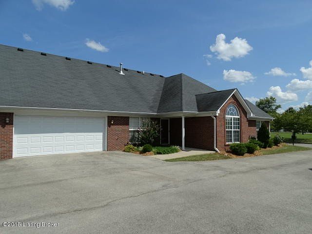View of garage and drive