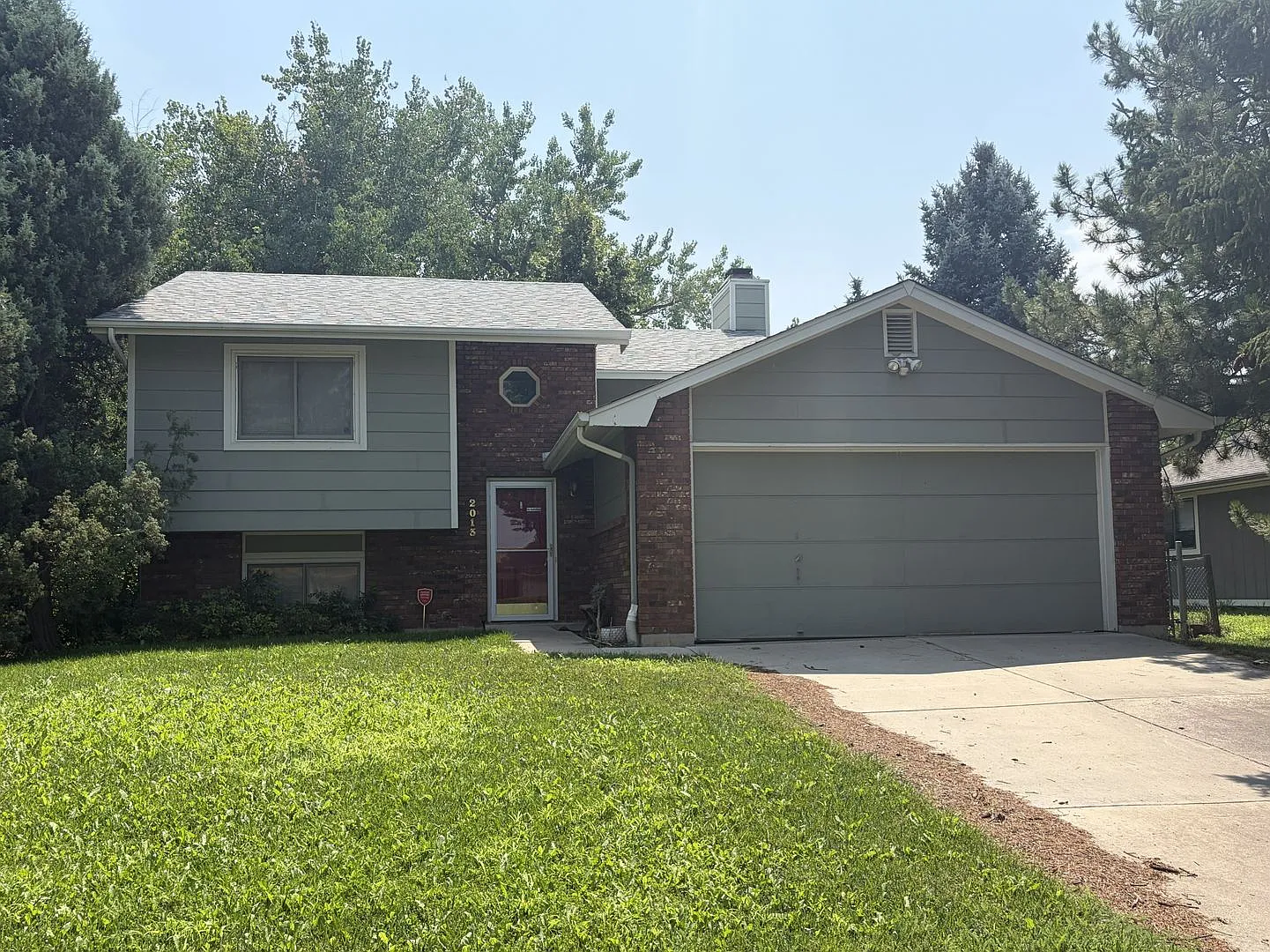 Spacious Split-Level Home with Large Fenced Yard + Garage — Photo 1