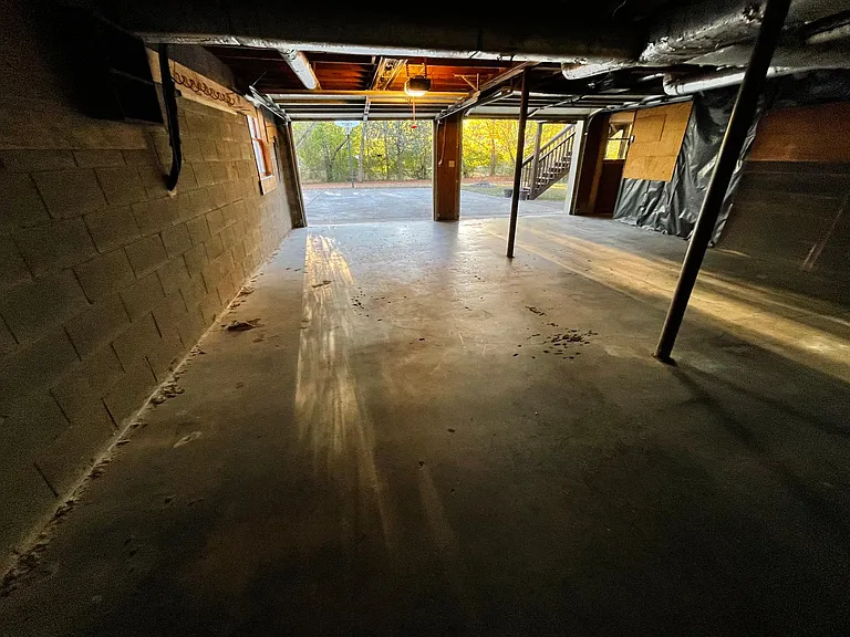 This is a picture of the garages from inside with the doors open. This shows you the extra long garage space that will accommodate most anything that you might want to store there. One thing you don't see is a long table at the end of the garage. You may
