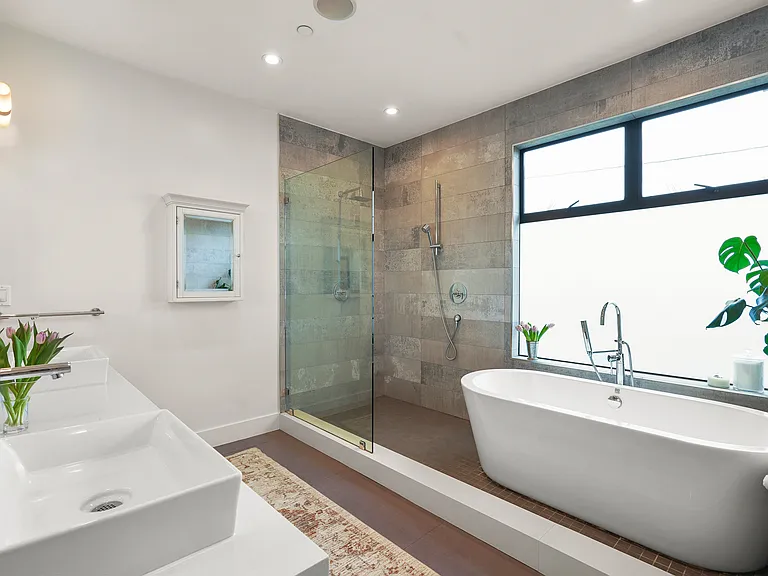Primary bath with deep soaking tub and walk in shower
