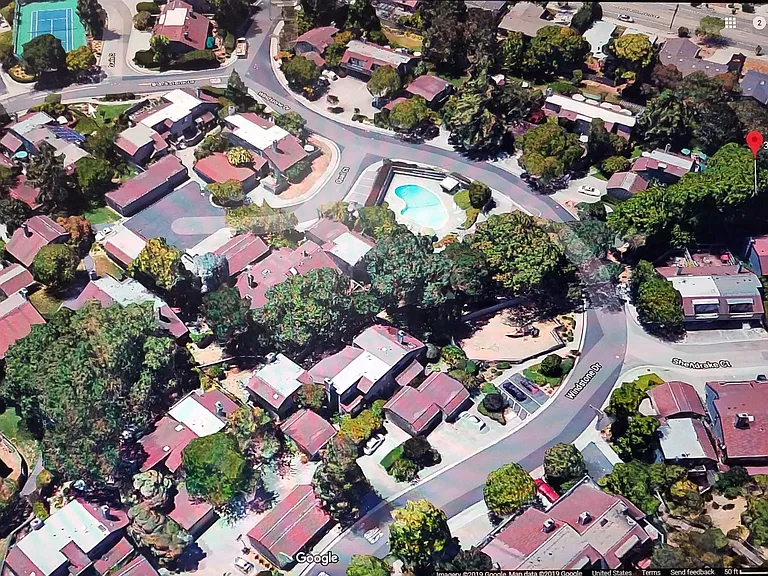 Property is in right lower corner: note fenced playground across the street, with pool behind it. Tennis court in top left corner.