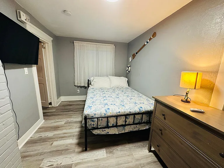 Queen size bed with 12 inch mattress and tv