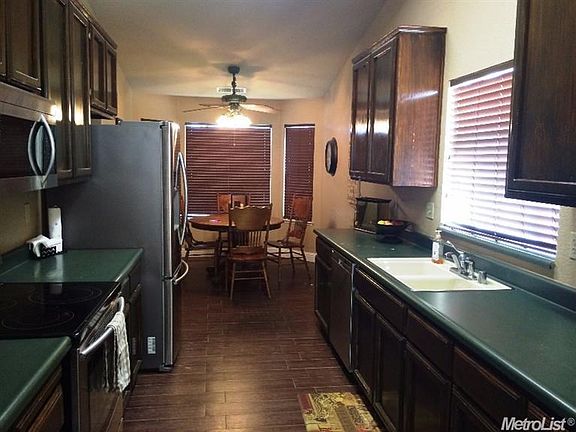 Large kitchen with a lot of counters and cabinets