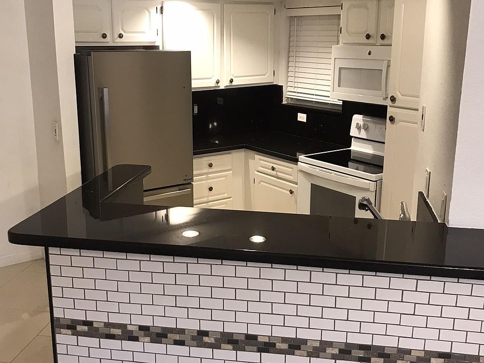 Kitchen with new fridge and oven
