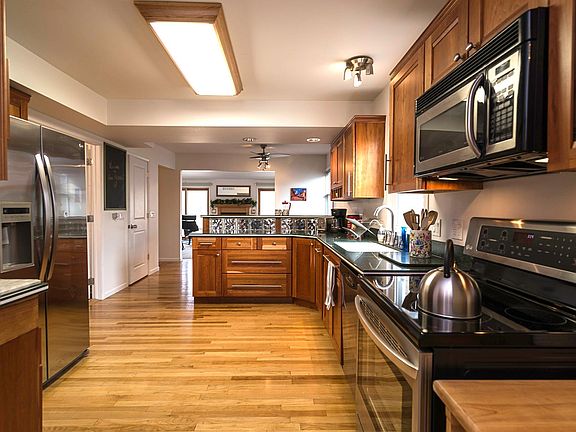 Entry from garage into kitchen. Has 3 closets just inside the door for easy storage = less clutter.