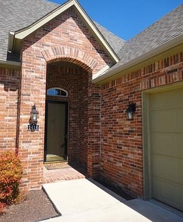 Inviting entry with covered front porch and full -length storm door.
