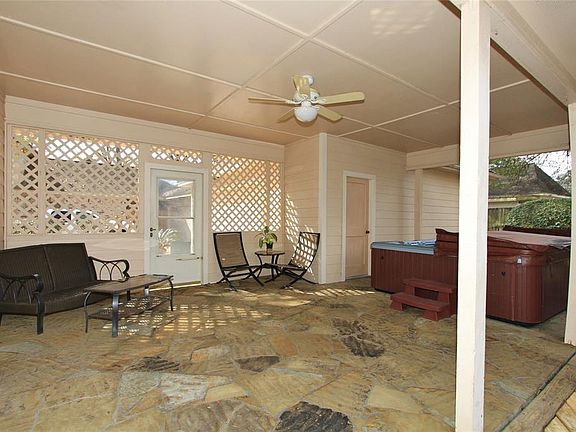 The Covered Patio features Slate floors and lattice work walls creating a marvelous area to relax. Also nestled into a private location is the hot tub.