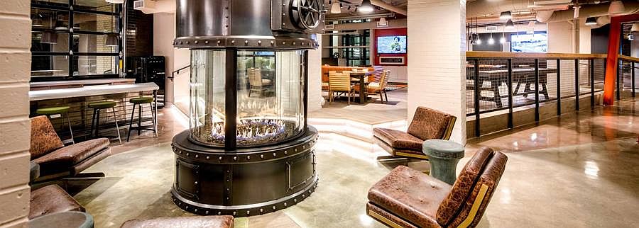 Lobby loft with fireplace feature and common area seating