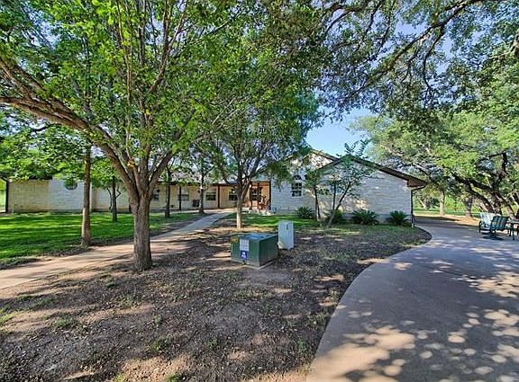 Front of home and one of two driveways