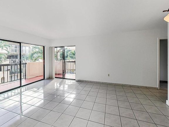 Spacious living room with tile floors
