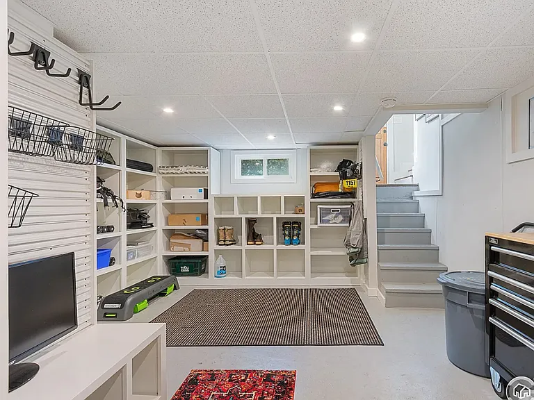 Downstairs bonus area for storage or other use; includes washer/dryer and finished closet offering more hanging space for clothes and gear