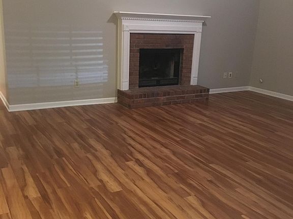 Living room with wood burning fireplace