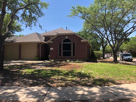 Gorgeous home surrounded by beautiful oak trees on corner lo
