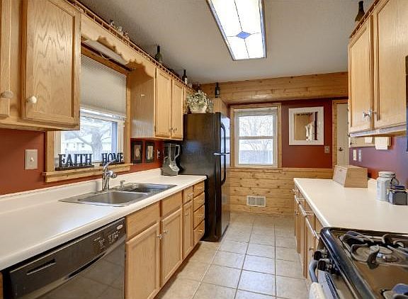 Updated kitchen with newer appliances and custom cabinets.