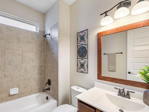 This nice bath is conveniently located near the main entry hallway of the house and is shared by the first floor secondary bedroom.