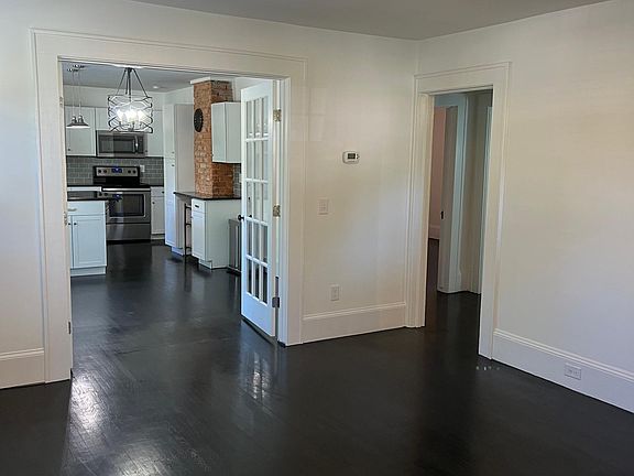 To the right of your living room is a hallway to your bathroom and two bedrooms.