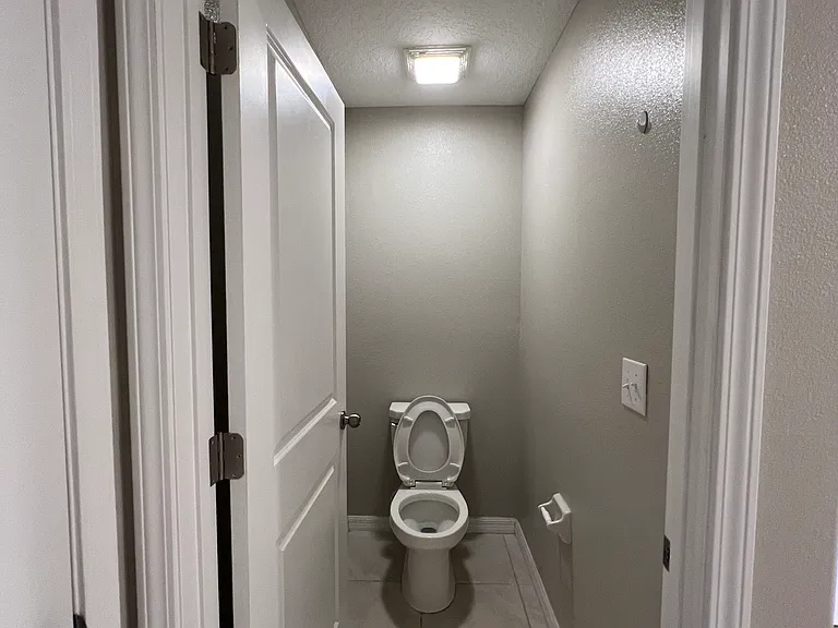 Master Bathroom toilet with door