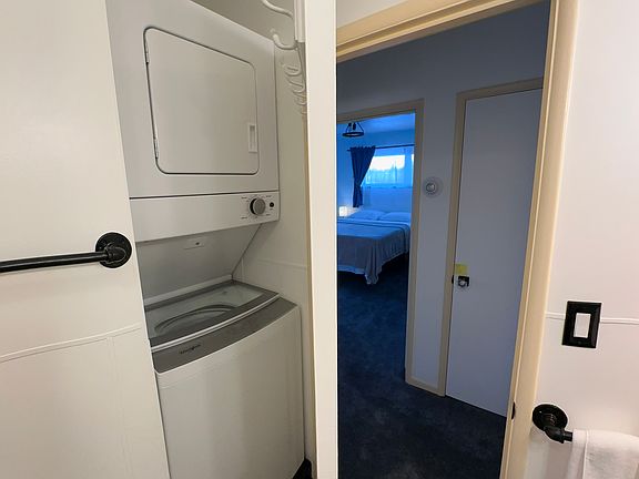 Stackable washer and dryer in bathroom
