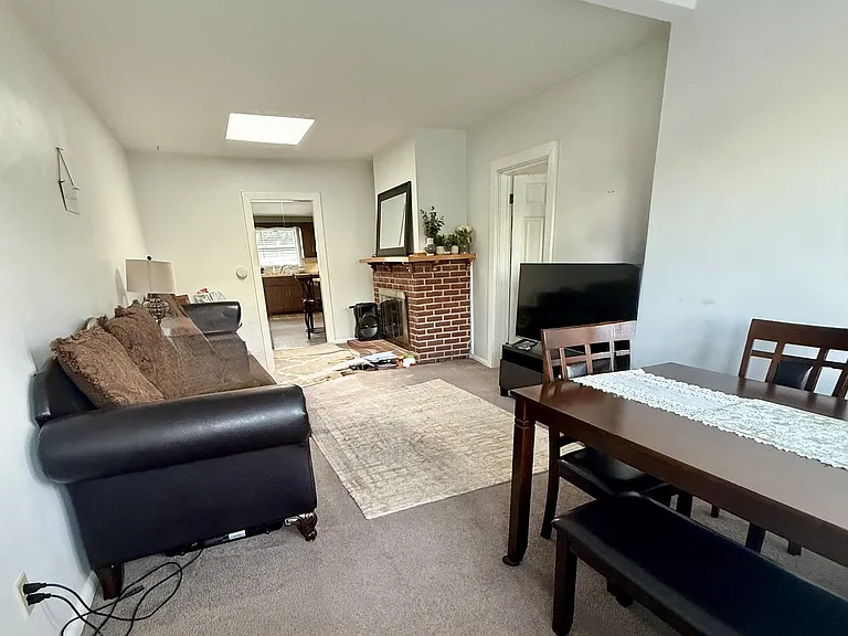 Another view of living room, fireplace is non-functioning