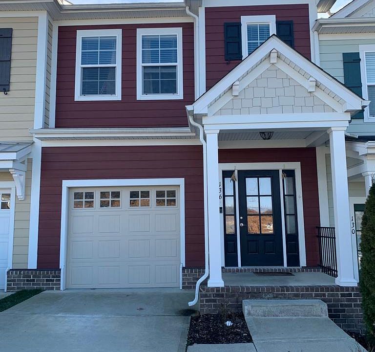 Front View with entrance porch and single car garage.