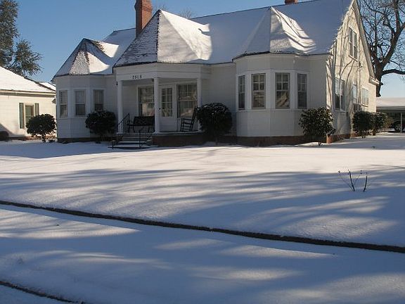 Our home after a snow fall : Side view of our Victorian style home with awesome bay windows.