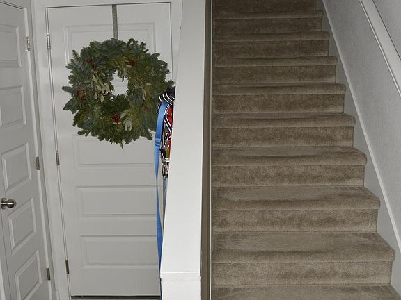 View from entry; entry to garage and stairs to the living area upstairs.