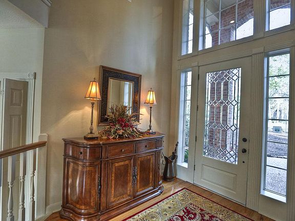 Warm two story entry welcomes your guests.