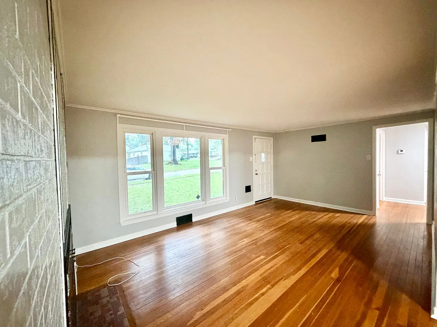  7047 Ranch with Hardwood Floors and Fresh Paint throughout + Large, Fenced Yard + 1 Car Garage — Photo 3