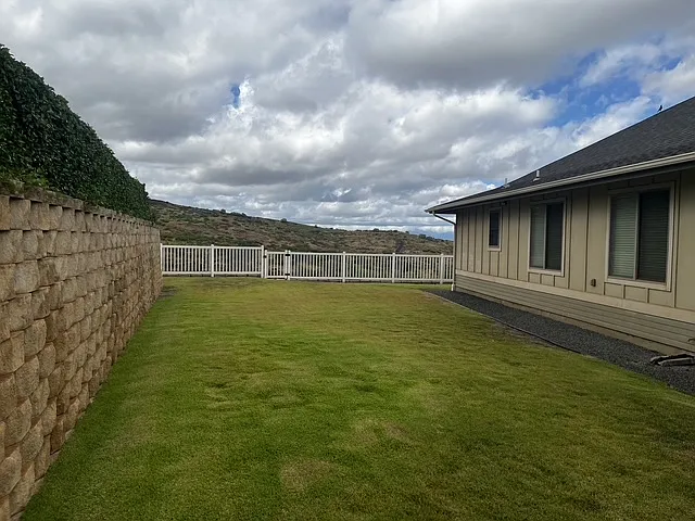 Large side yard on left of house
