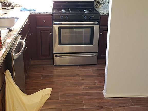 Kitchen viewed from the bonus room. Laundry area on the right is hook up ready for washer and gas dryer.