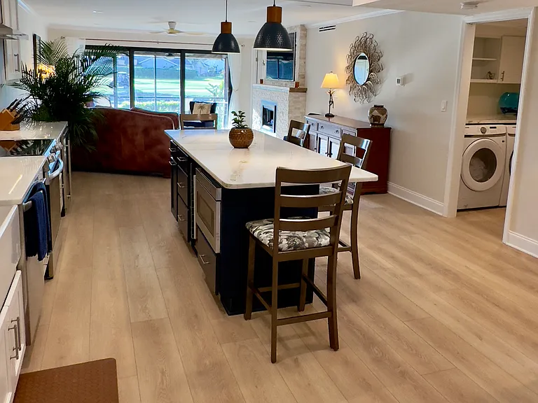 8 foot kitchen island with marble counter, microwave drawer, storage and outlets! Plenty of space for entertaining friends and family.